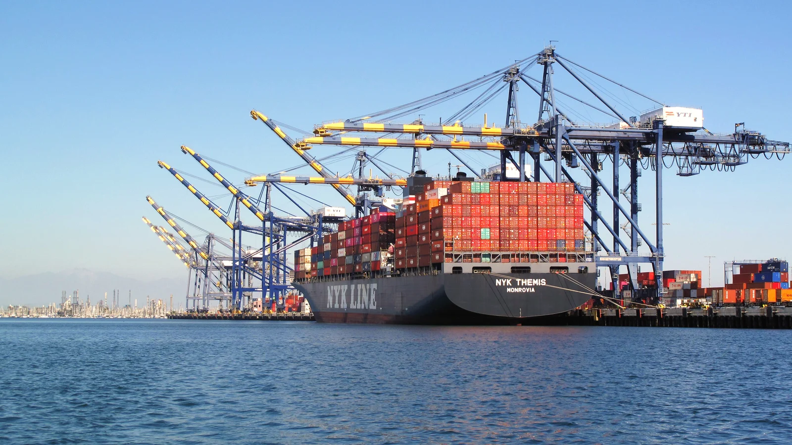 NYK container ship being worked under gantry cranes at the Port of Los Angeles