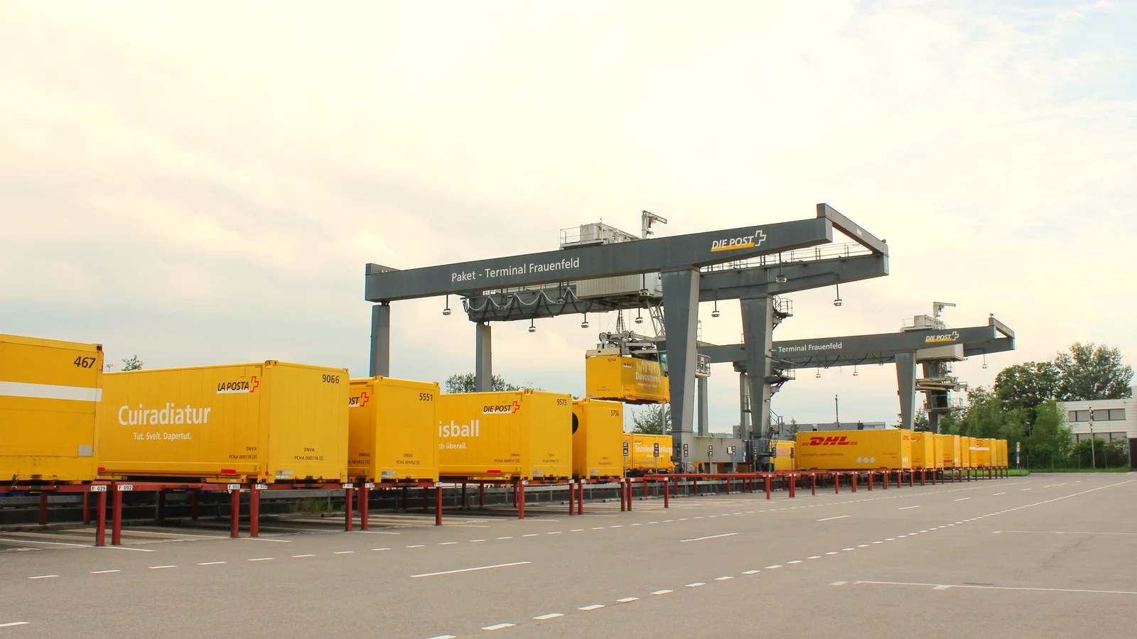 Swap bodies and gantry cranes at the rail terminal of a Swiss parcel centre