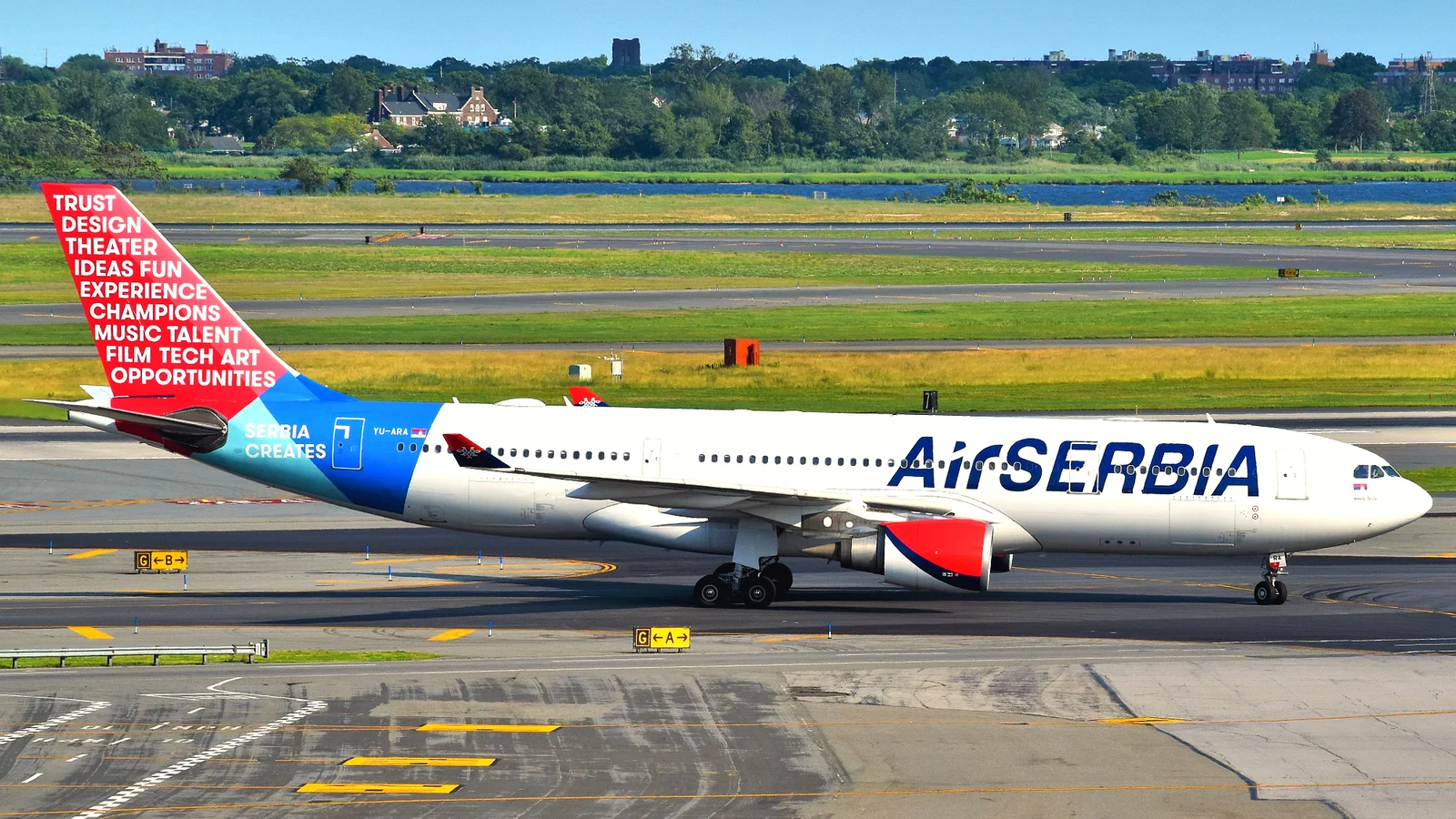 Airbus A330 passenger jet taxiing at JFK airport in daylight