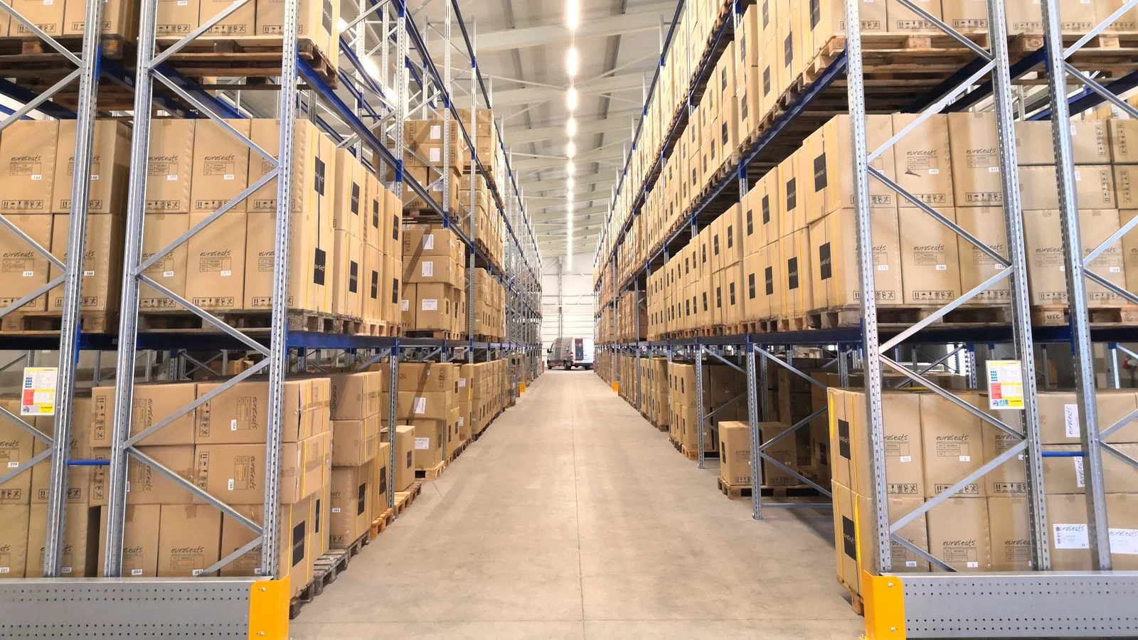 Warehouse aisle with pallet racks holding boxed goods
