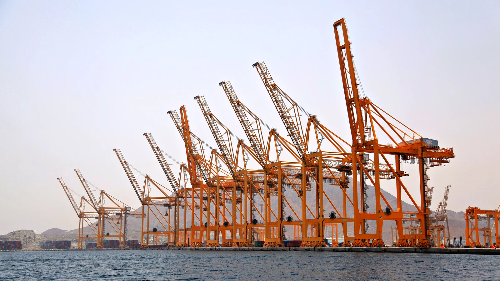 Ship-to-shore cranes at Khor Fakkan container port on the Gulf of Oman